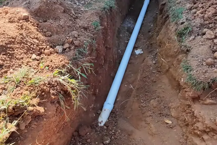 A cast iron drain or sewer pipe shows corrosion, scale, or repair work near Whittier, CA on Plumber in Whittier, CA