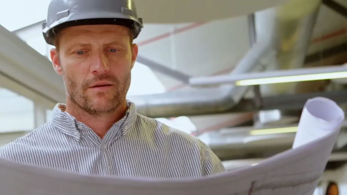 A plumbing contractor reviews job plans before work begins near Cerritos, CA on Plumbing Services in Cerritos, CA