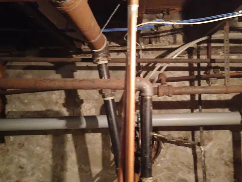 Crawl space or basement piping is inspected where access is tight near Cerritos, CA on Commercial Plumbing in Cerritos, CA