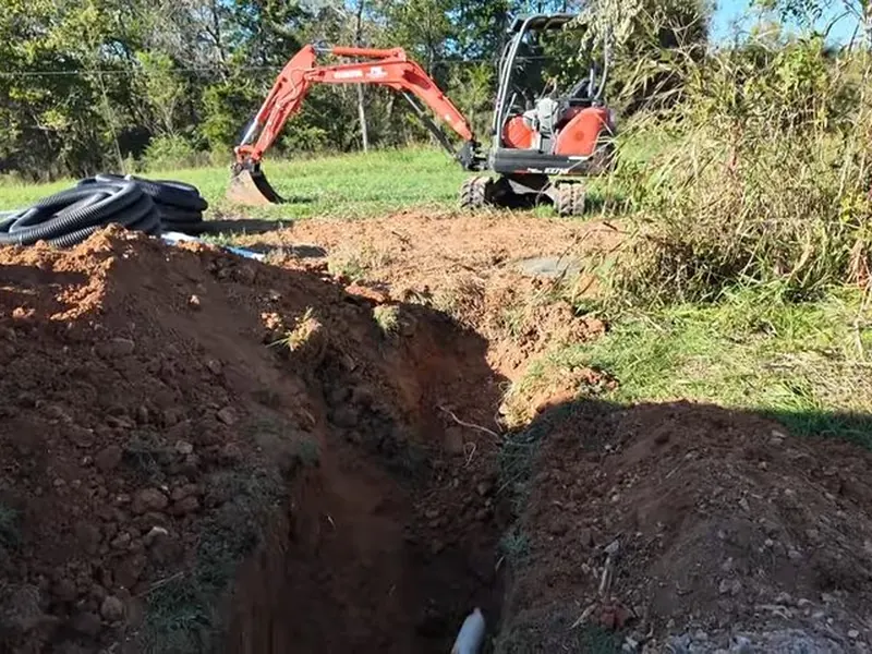 Exterior sewer work shows trenchless equipment, open excavation, or new pipe placement near Cerritos, CA on Sewer Line Replacement in Cerritos, CA