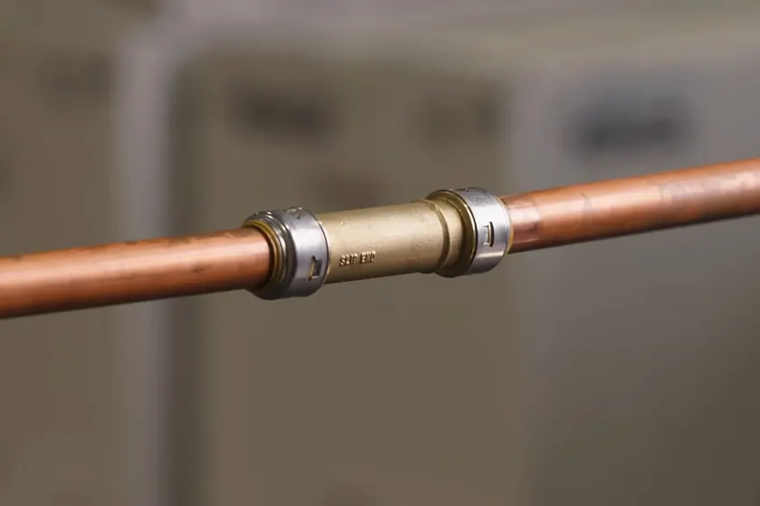 PEX and copper supply piping are fitted during repipe or line repair work near Heritage Park Area, Cerritos, CA on Plumber in the Heritage Park Area, Cerritos, CA
