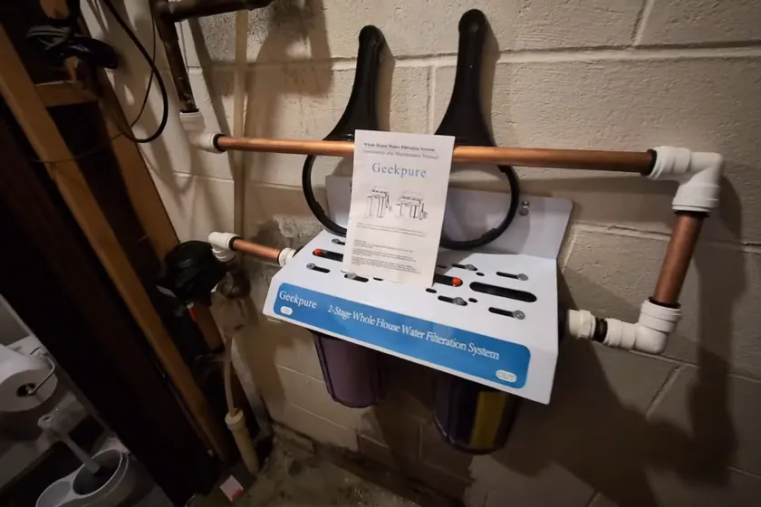 Under-sink filtration components are arranged for a cleaner drinking water connection near Cerritos, CA on Manganese in Cerritos’s Municipal Wells: What Homeowners Should Know