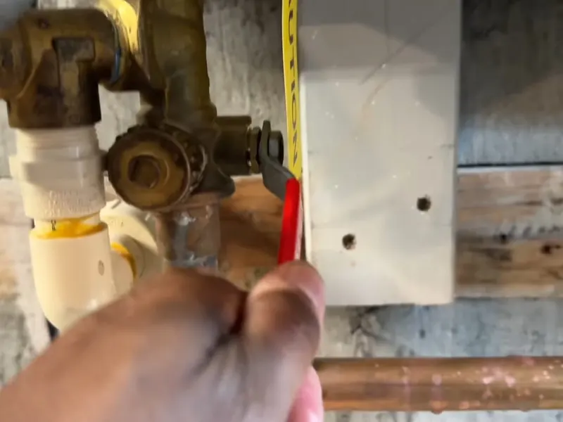 A tankless water heater connection is inspected during installation or service near Cerritos, CA on Tankless Water Heater Services in Cerritos, CA body tl 002