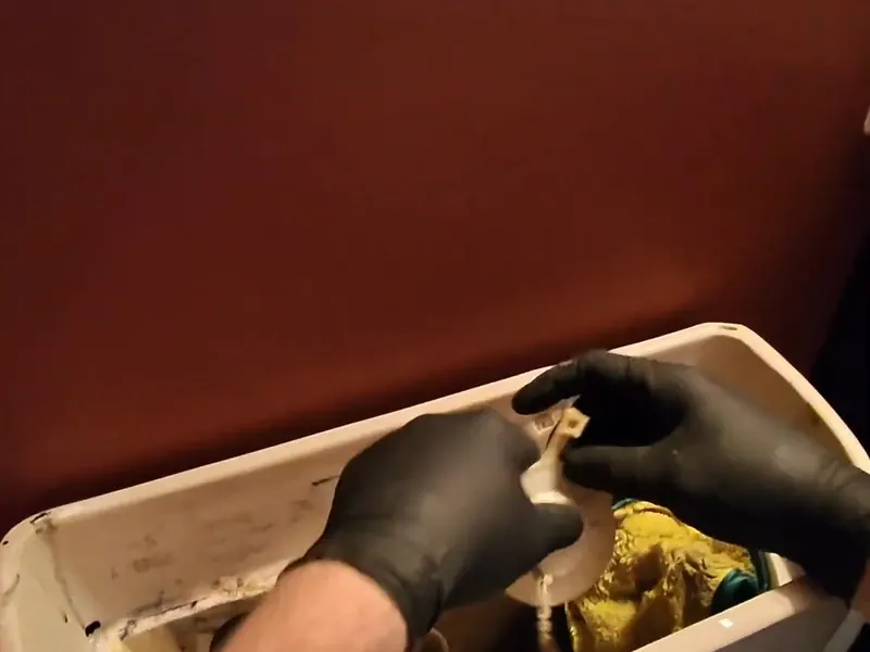 Toilet tank parts and fixture connections are checked during repair work near Cerritos, CA on Toilet Repair & Installation in Cerritos, CA