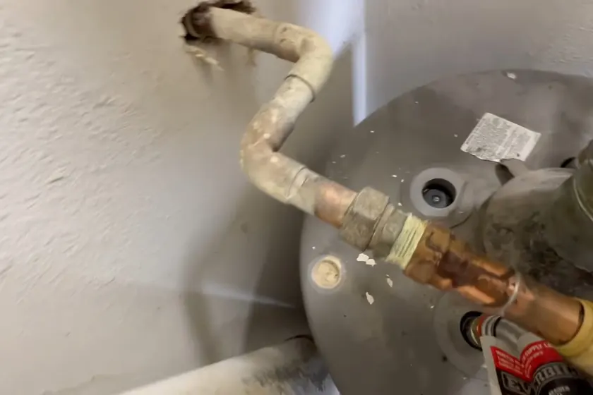 A water heater tank, valve, or supply connection is inspected during service near Buena Park, CA on Plumber in Buena Park, CA