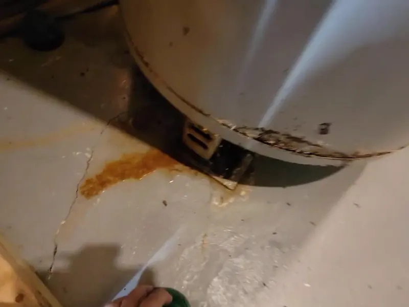 A water heater tank, valve, or supply connection is inspected during service near Cerritos, CA on Water Heater Repair in Cerritos, CA body whr 002