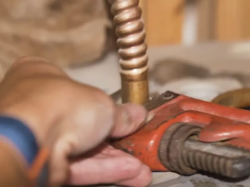 A water heater tank, valve, or supply connection is inspected during service near Cerritos, CA on Copper-to-PEX Repipe Cost in South LA County: What Cerritos Homeowners Actual