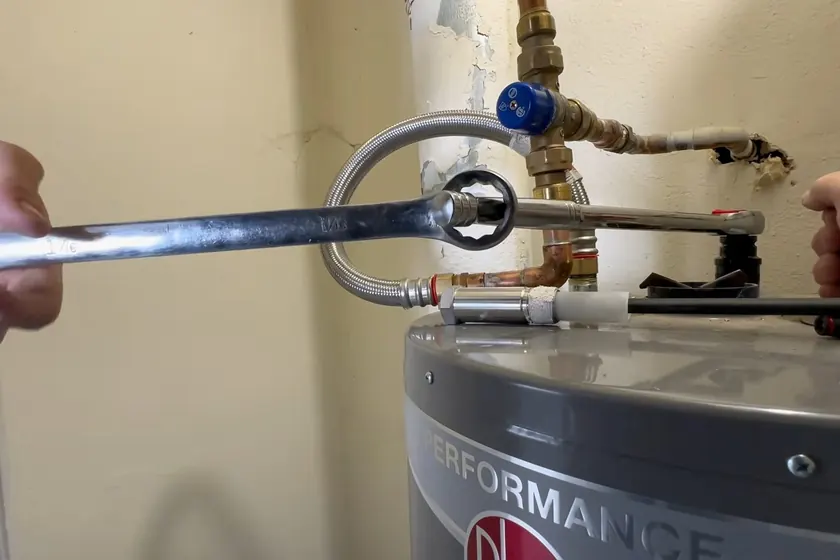 A water heater tank, valve, or supply connection is inspected during service near Cypress, CA on Plumber in Cypress, CA