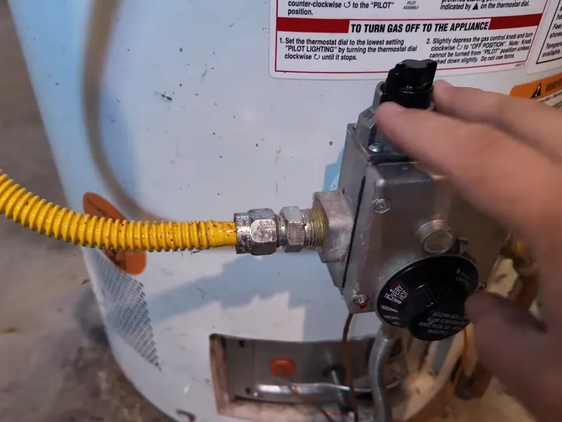 A water heater tank, valve, or supply connection is inspected during service near Cerritos, CA on Gas Line Installation & Repair in Cerritos, CA body glr 002