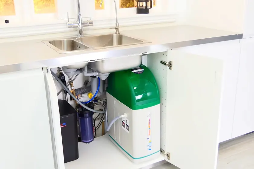 A water softener system is inspected with its brine tank, valve head, or inlet piping visible near Carmenita Road Area, Cerritos, CA on Plumber in the Carmenita Road Area, Cer