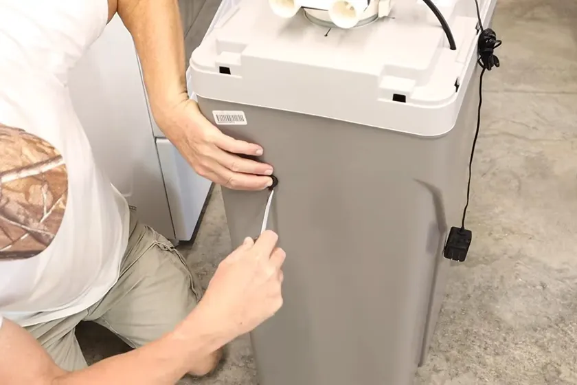 A water softener system is inspected with its brine tank, valve head, or inlet piping visible near Cerritos, CA on Hard Water in Cerritos: What 280–300 ppm Means for Your Plum blog b6 002